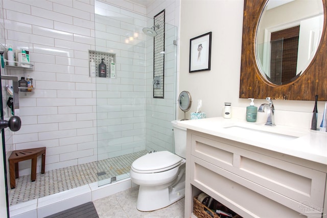 full bath featuring toilet, walk in shower, and vanity