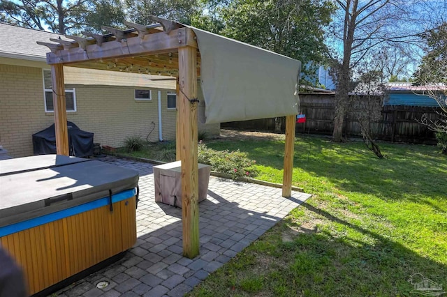view of patio / terrace with fence, a pergola, a hot tub, and a grill
