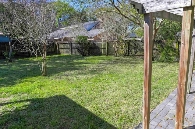 view of yard featuring a fenced backyard