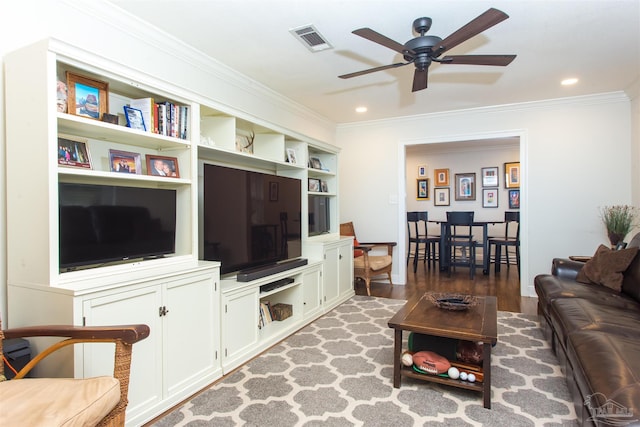living room with visible vents, wood finished floors, recessed lighting, crown molding, and ceiling fan