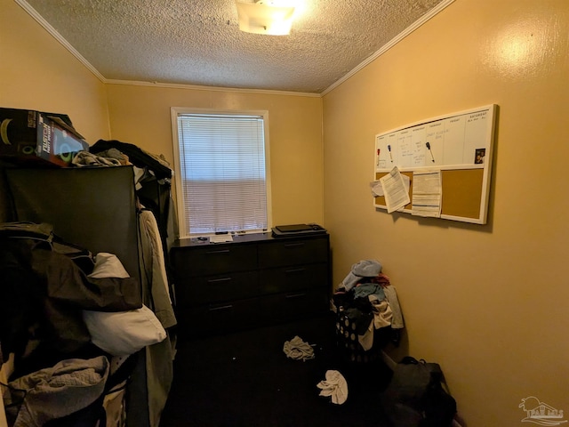 bedroom featuring crown molding and a textured ceiling