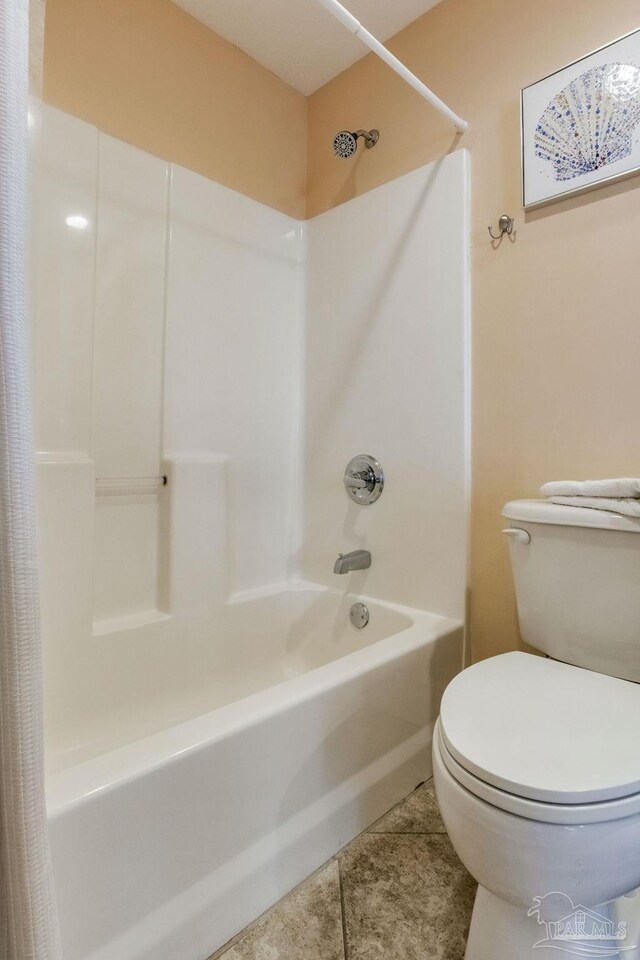 521 W Beach Blvd Unit 702, Gulf Shores, AL 36542 - full bath featuring tile patterned floors, toilet, and shower / bathtub combination with curtain