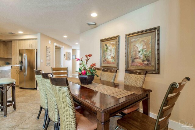 521 W Beach Blvd Unit 702, Gulf Shores, AL 36542 - dining space with light tile patterned floors, baseboards, visible vents, and recessed lighting