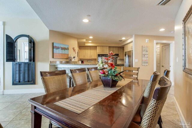 521 W Beach Blvd Unit 702, Gulf Shores, AL 36542 - dining room with light tile patterned floors, baseboards, visible vents, a textured ceiling, and recessed lighting