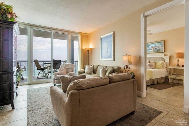 521 W Beach Blvd Unit 702, Gulf Shores, AL 36542 - living room with light tile patterned floors and a textured ceiling