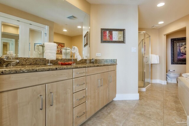 521 W Beach Blvd Unit 702, Gulf Shores, AL 36542 - full bath with double vanity, a shower stall, visible vents, and recessed lighting
