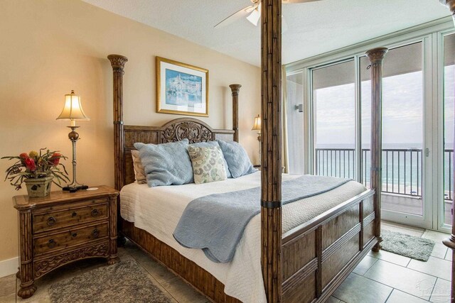 521 W Beach Blvd Unit 702, Gulf Shores, AL 36542 - tiled bedroom featuring ceiling fan and access to outside