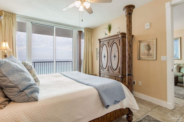 521 W Beach Blvd Unit 702, Gulf Shores, AL 36542 - bedroom with light tile patterned floors, access to outside, baseboards, and ceiling fan