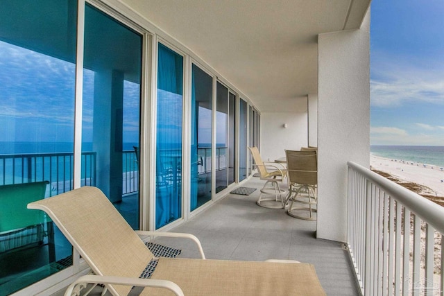 521 W Beach Blvd Unit 702, Gulf Shores, AL 36542 - balcony featuring a water view and a beach view