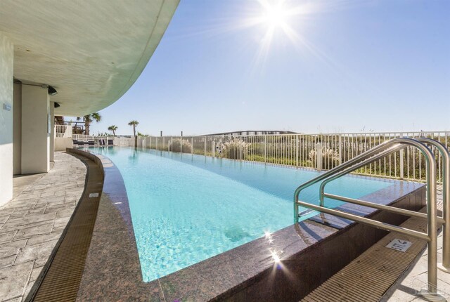 521 W Beach Blvd Unit 702, Gulf Shores, AL 36542 - view of swimming pool featuring a fenced in pool