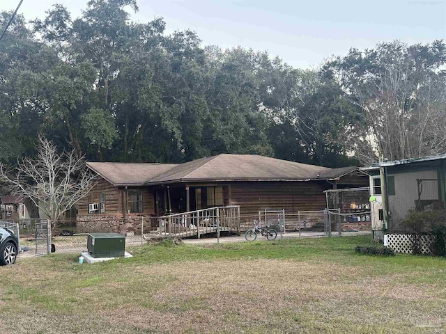 back of house featuring a porch and a lawn