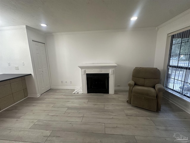 unfurnished room featuring ornamental molding and light wood-type flooring