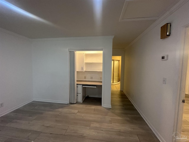 corridor featuring crown molding and wood-type flooring