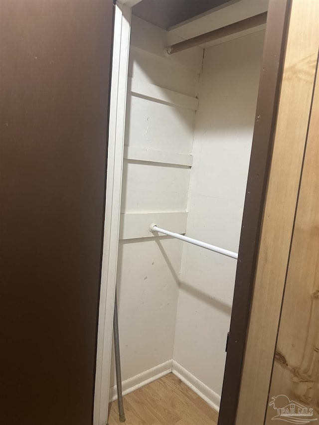 walk in closet featuring light hardwood / wood-style flooring