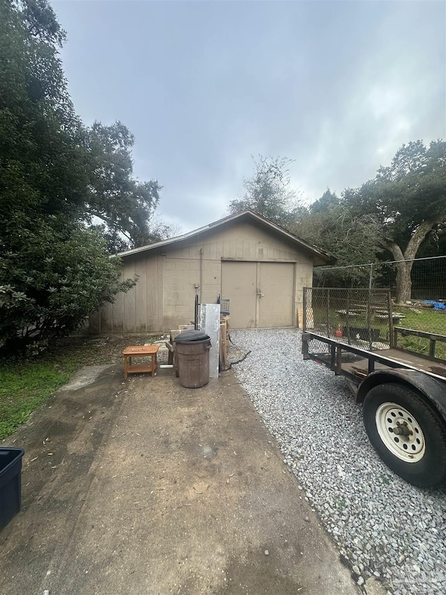 view of side of property featuring an outbuilding