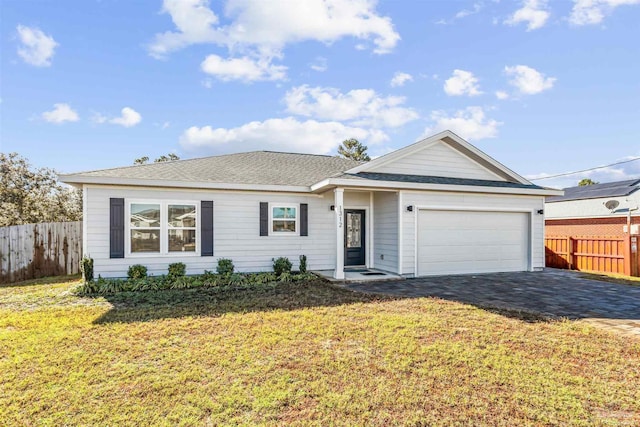 single story home featuring a front yard and a garage