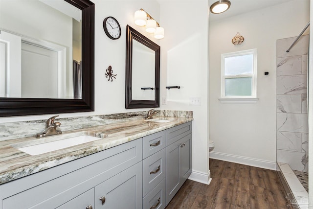 bathroom featuring hardwood / wood-style floors, vanity, toilet, and a shower with curtain