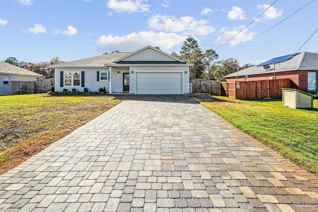 single story home with a garage and a front yard