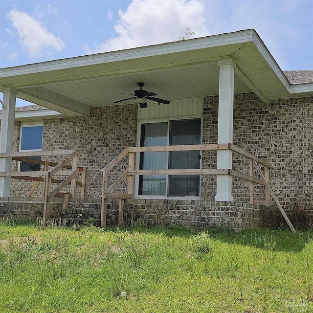 exterior space featuring ceiling fan