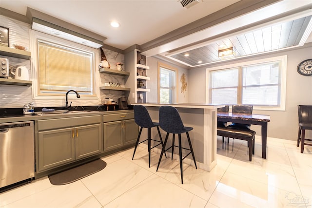 kitchen with dishwasher, dark countertops, a breakfast bar area, open shelves, and a sink