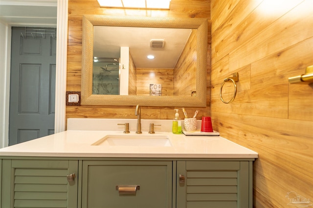 bathroom with wooden walls and vanity