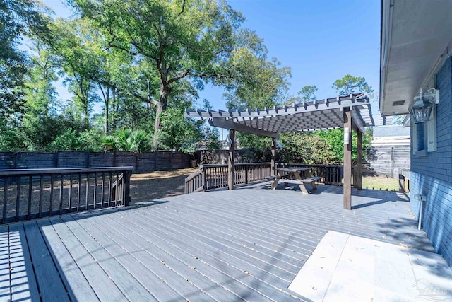 deck featuring a fenced backyard and a pergola