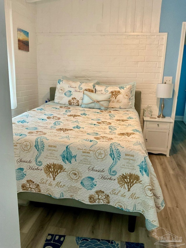 bedroom with light wood finished floors