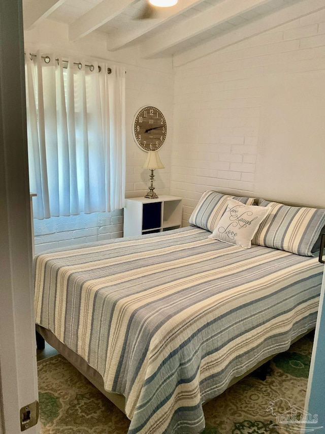 bedroom featuring beam ceiling