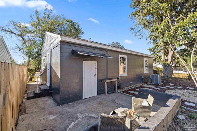 back of property featuring a patio area and central air condition unit