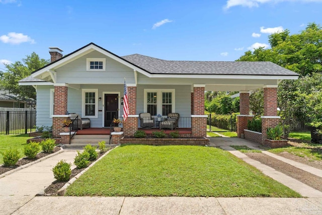 1703 E Avery St, Pensacola, FL 32503 - bungalow featuring covered porch, brick siding, and a chimney