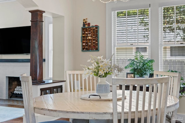 1703 E Avery St, Pensacola, FL 32503 - dining area featuring decorative columns and a brick fireplace