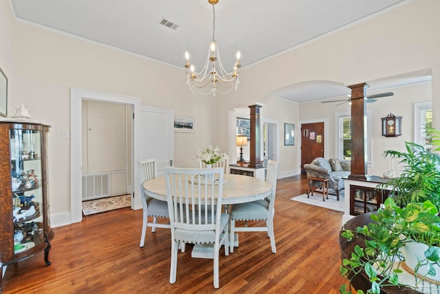 1703 E Avery St, Pensacola, FL 32503 - dining area featuring arched walkways, decorative columns, crown molding, wood finished floors, and a ceiling fan