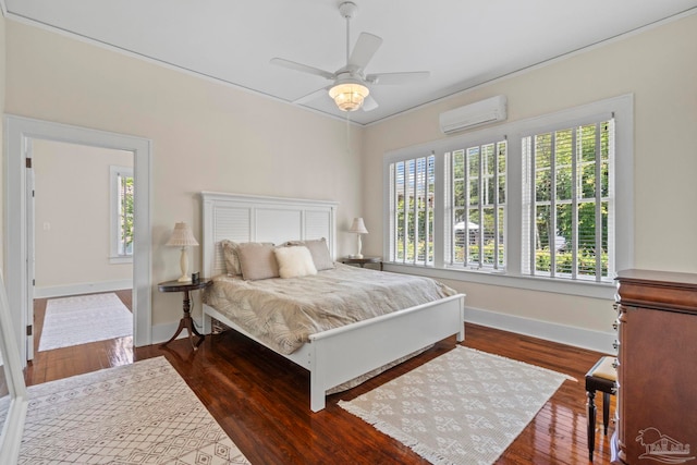 1703 E Avery St, Pensacola, FL 32503 - bedroom featuring a wall unit AC, wood finished floors, and ceiling fan
