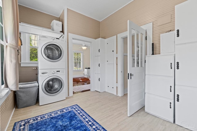 1703 E Avery St, Pensacola, FL 32503 - laundry area featuring estacked washer and dryer, a ceiling fan, and light wood finished floors