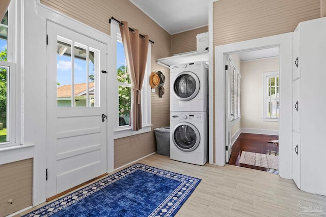 1703 E Avery St, Pensacola, FL 32503 - washroom featuring estacked washer and dryer and wood finished floors