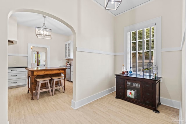 1703 E Avery St, Pensacola, FL 32503 - corridor with healthy amount of natural light, arched walkways, and a chandelier