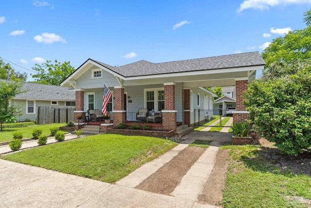 1703 E Avery St, Pensacola, FL 32503 - view of front of property featuring brick siding, dirt driveway, a porch, and a gate