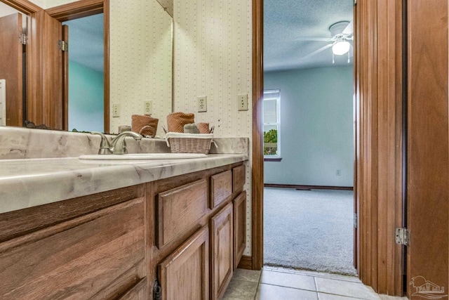 bathroom featuring vanity, tile patterned flooring, and ceiling fan