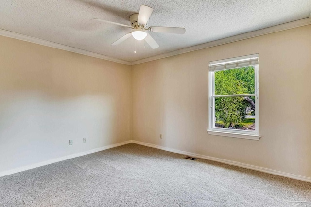 carpeted empty room with a textured ceiling, crown molding, and ceiling fan