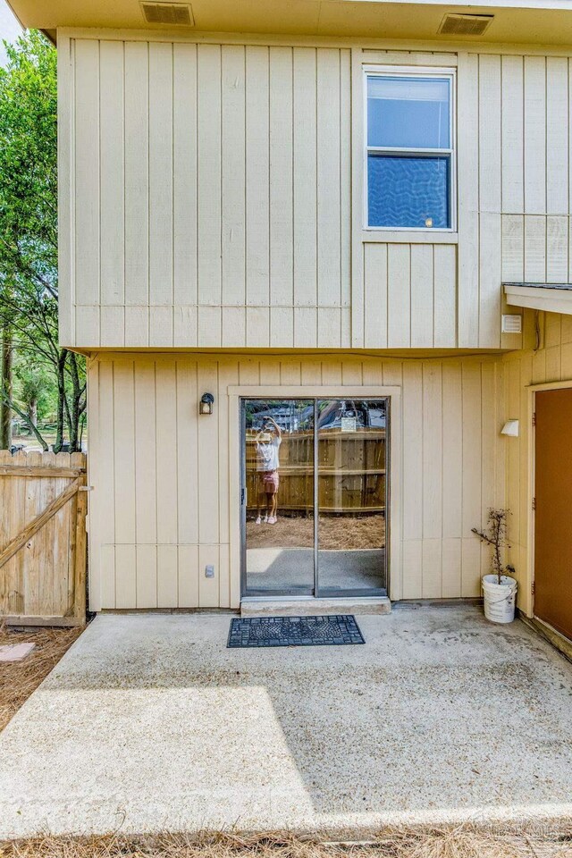 entrance to property with a patio area