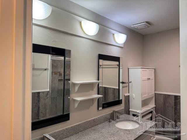 bathroom featuring visible vents and vanity