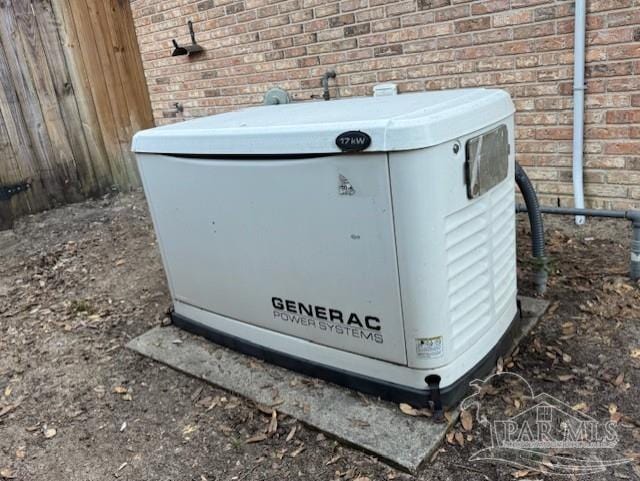 exterior details featuring a power unit and brick siding