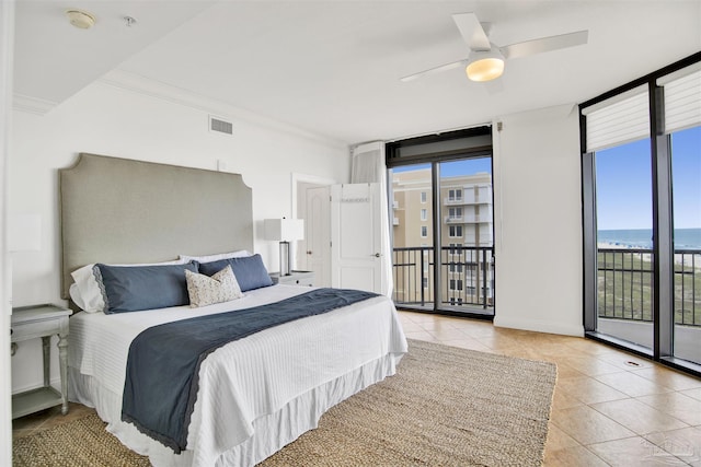 17075 Perdido Key Dr Unit 4E, Pensacola, FL 32507 - bedroom featuring expansive windows, light tile patterned floors, access to exterior, and ceiling fan
