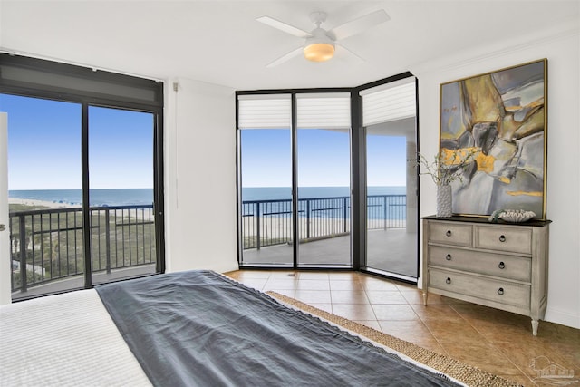 17075 Perdido Key Dr Unit 4E, Pensacola, FL 32507 - tiled bedroom featuring floor to ceiling windows, a water view, and access to exterior