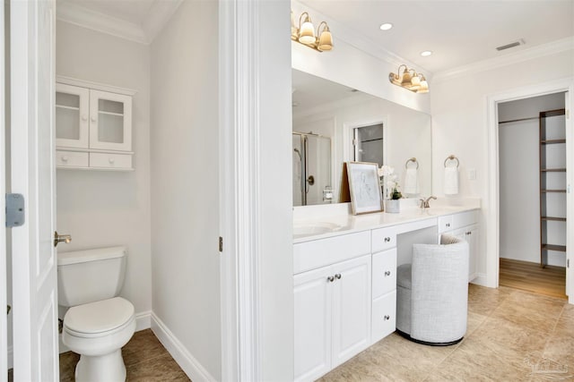 17075 Perdido Key Dr Unit 4E, Pensacola, FL 32507 - bathroom featuring double vanity, ornamental molding, a stall shower, toilet, and baseboards