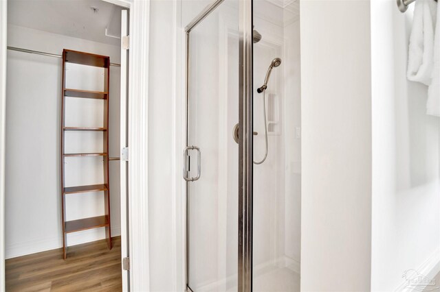 17075 Perdido Key Dr Unit 4E, Pensacola, FL 32507 - full bath with a stall shower, wood finished floors, and baseboards