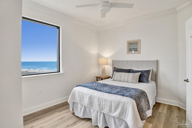 17075 Perdido Key Dr Unit 4E, Pensacola, FL 32507 - bedroom featuring wood finished floors, ornamental molding, baseboards, and a ceiling fan