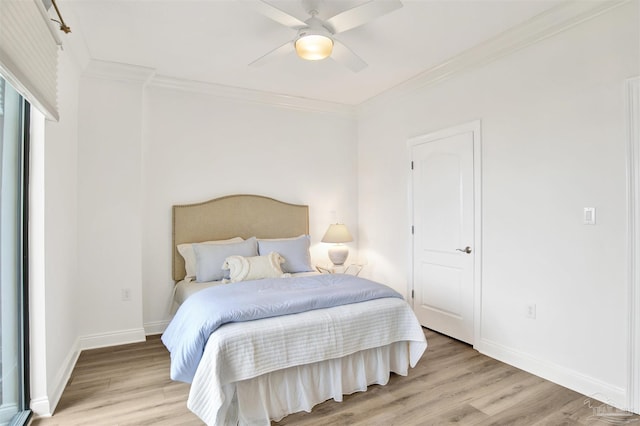 17075 Perdido Key Dr Unit 4E, Pensacola, FL 32507 - bedroom with light wood-type flooring, crown molding, baseboards, and a ceiling fan