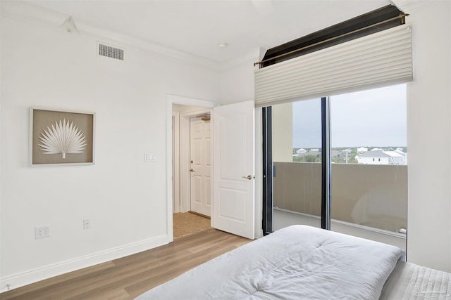 17075 Perdido Key Dr Unit 4E, Pensacola, FL 32507 - bedroom featuring wood finished floors and baseboards