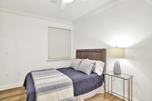 17075 Perdido Key Dr Unit 4E, Pensacola, FL 32507 - bedroom featuring wood finished floors, ornamental molding, baseboards, and a ceiling fan